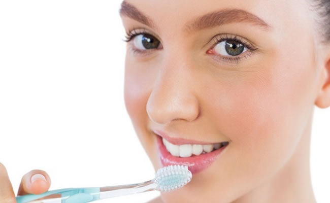 scrub-Gently-using-a-Toothbrush-to-get-healthy-pink-lips
